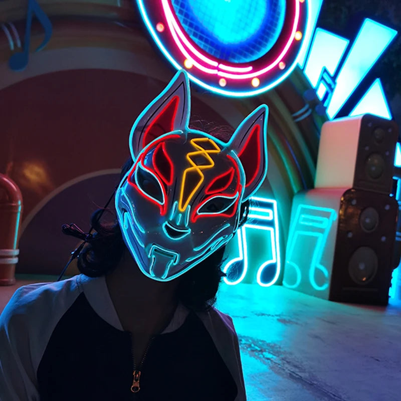 Person wearing a neon fox mask in a vibrant, neon-lit room.
