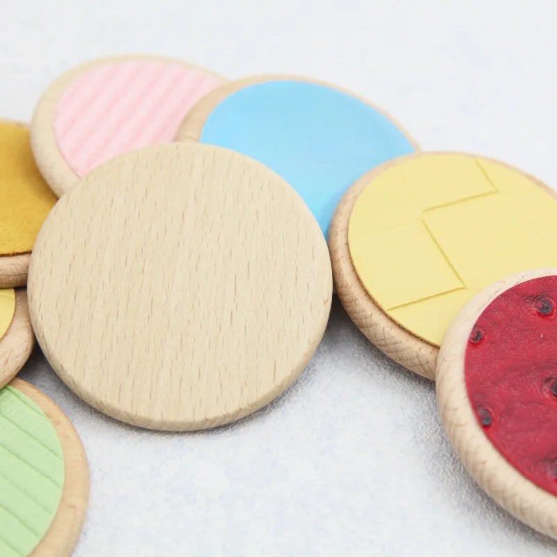 Colorful round wooden toys on a light background