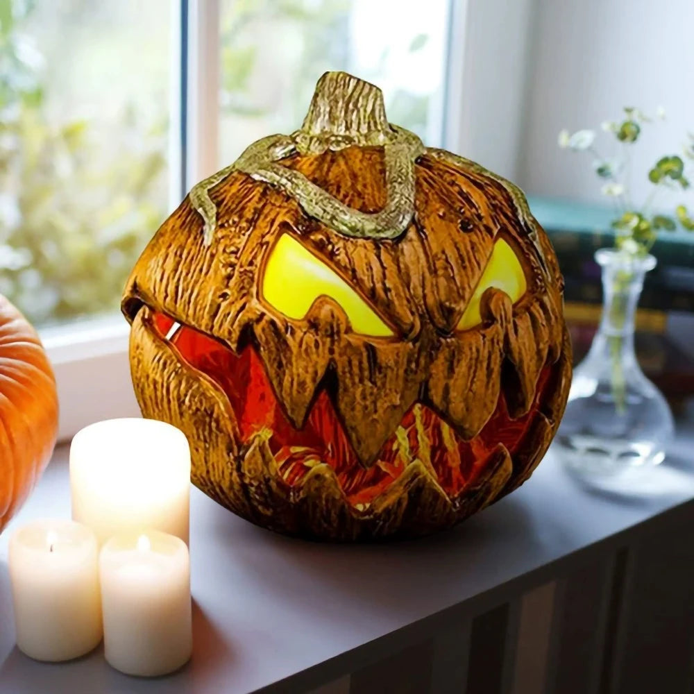 Decorative pumpkin with a carved face on a table with candles