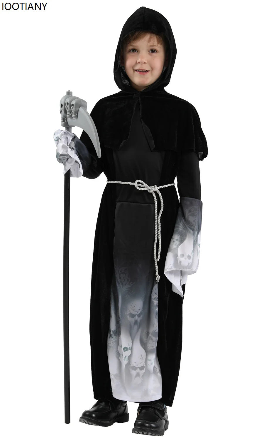 Child wearing a black hooded costume with a long robe, holding a staff, on a white background.