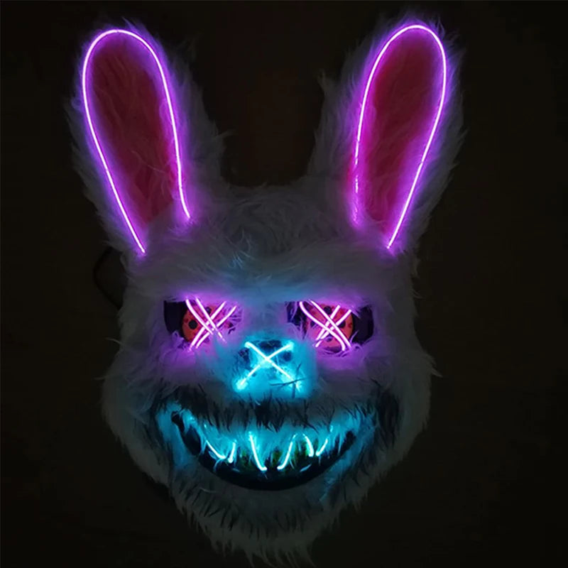 Luminous rabbit mask with glowing pink ears and multicolor face on a black background