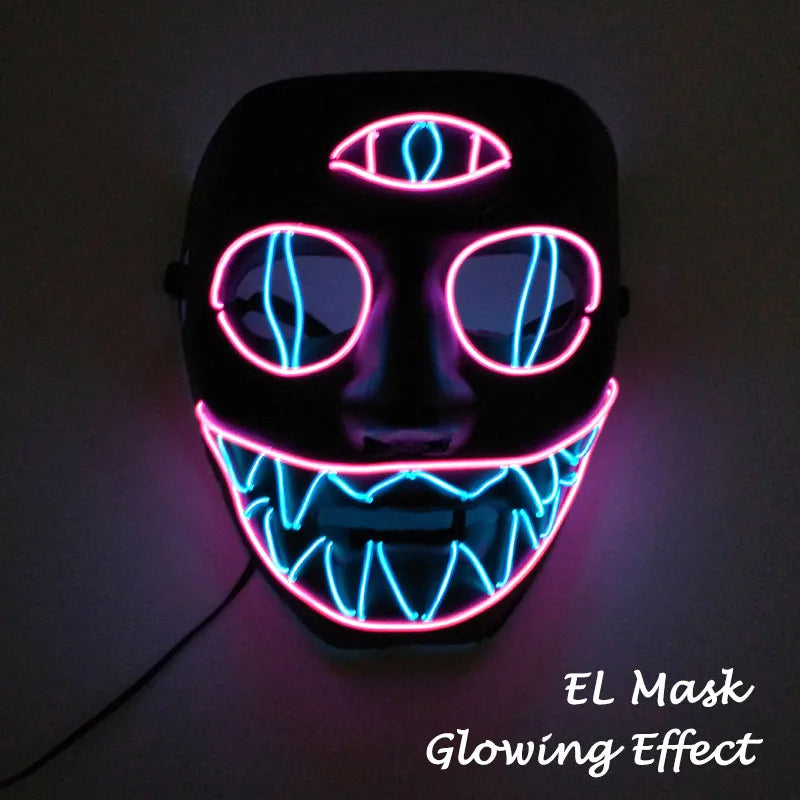 Black mask with EL wire glowing in pink and blue on a dark background