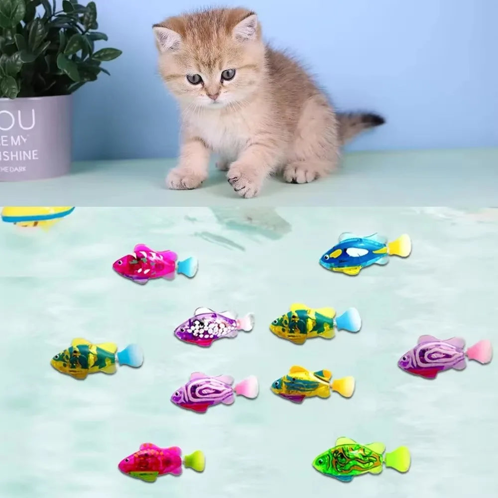 Cat playing with colorful fish-shaped toys on a light green surface.